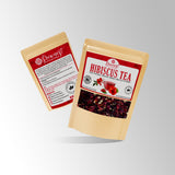 Load image into Gallery viewer, Brewed hibiscus tea in glass cup