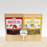 Load image into Gallery viewer, Two packages of Brewfest tea, one with hibiscus tea and the other with chamomile tea, on a light background.